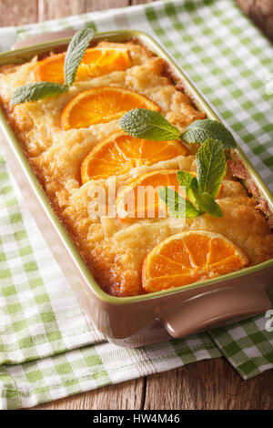 Greek Orange filo pie portokalopita close-up in a baking dish. vertical Stock Photo