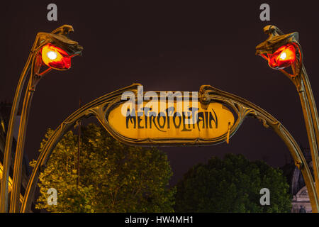 PARIS - JULY 12, 2014: Art Noveau Metropolitan sign in Place St. Michel. Saint Michel station located in the center of Paris, near Notre Dame Cathedra Stock Photo