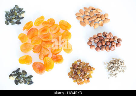 Delicacies, different spices scattered on the white background. Stock Photo