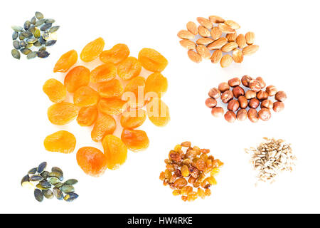 Delicacies, different spices scattered on the white background. Stock Photo