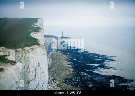 Right bellow the Beachy Head cliff you find the Beachy Head Lighthouse that was built in the sea to avoid ship collisions when the weather is misty an Stock Photo