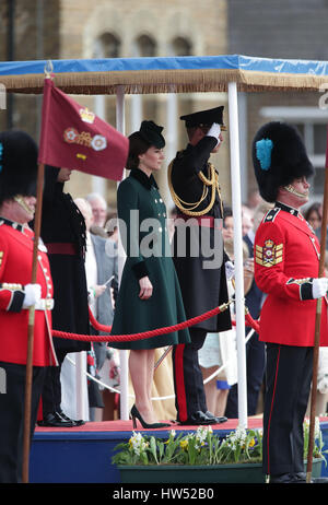 The Duke of Cambridge, Colonel of the Irish Guards, and the Duchess of Cambridge, visit the 1st Battalion Irish Guards during the St. Patrick's Day Parade, at the Cavalry Barracks, in Hounslow, where the Duchess will present the traditional sprigs of shamrock to the Officers and Guardsmen. Stock Photo