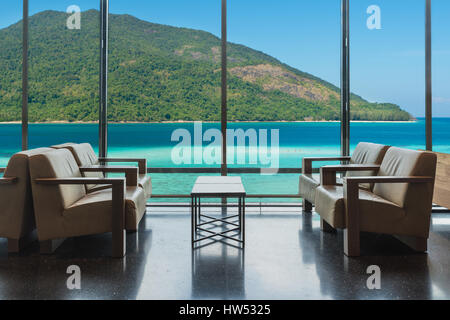 Luxury hotel lounge with windows overlooking sea in Phuket, Thailand. Summer, Travel, Vacation and holiday concept. Stock Photo
