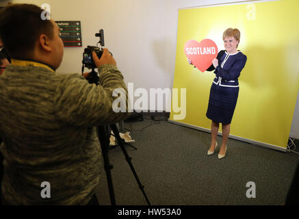 First Minister and SNP leader Nicola Sturgeon visits a photo booth during the SNP Spring Conference at the AECC in Aberdeen. Stock Photo