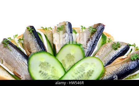 Sprats sandwiches, appetizer on plate isolated on white Stock Photo