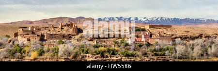 Snowy High Atlas Mountains above Kalaat M'Gouna town in Morocco Stock Photo