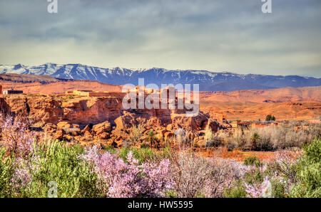 Snowy High Atlas Mountains above Kalaat M'Gouna town in Morocco Stock Photo