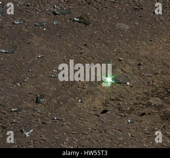 pieces of broken glass scattered on the ground Stock Photo