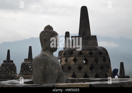 Borobudur is a 9th-century Mahayana Buddhist temple in Magelang, Central Java, Indonesia, as well as the world's largest Buddhist temple. Stock Photo