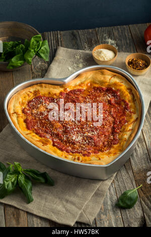 Homemade Heart Shaped Chicago Deep Dish Pizza for Valentine's Day Stock Photo