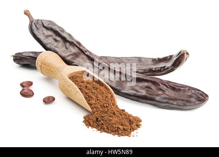 Carob powder and pods isolated on white Stock Photo