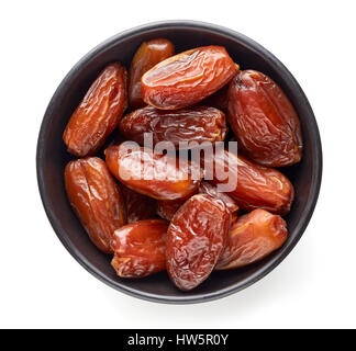 Bowl of pitted dates isolated on white background, top view