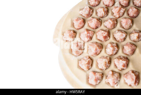 Step by step process of making home-made dumplings, ravioli or pelmeni with minced meat filling using ravioli mold or ravioli maker. Stock Photo