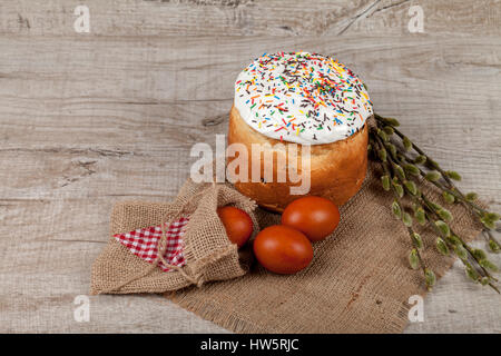 Homemade Easter cake and painted eggs on the table Stock Photo