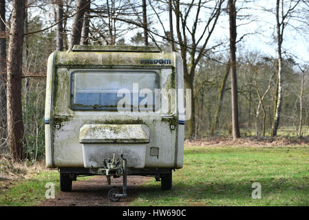 Front of a dirty vintage Polish-made PREDOM caravan of polyester on a camping site in The Netherlands Stock Photo