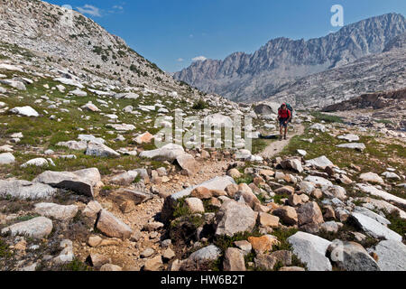 CA03082-00...CALIFORNIA - Hiker on the JMT/PCT north of Muir Pass in Kings Canyon National Park. Stock Photo