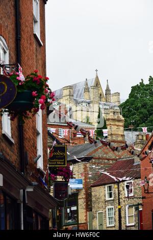 LINCOLN UK 20 JULY  2015: Looking up at Lincoln Cathedral from steep Hill Stock Photo