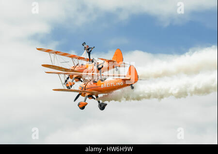 Breitling Wingwalkers aerobatic and gymnastic formation display team performing at the Farnborough Airshow, UK Stock Photo