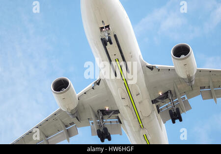 closeup of a large low level flying jet aircraft Stock Photo