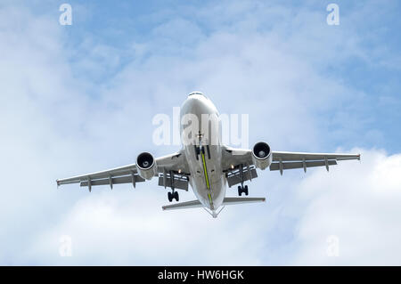 large passenger jet aircraft on final landing approach Stock Photo