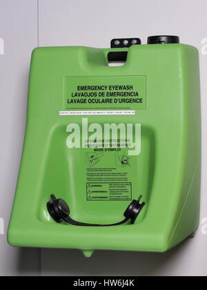 Industrial wall mounted eye wash station in green plastic ready to be used in emergency, Australia 2015 Stock Photo