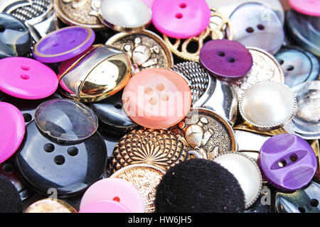 Buttons background. Colored shiny clothing button texture. Colored sewing buttons pattern concept wallpaper. Mixed colors. Studio photo texture photo Stock Photo