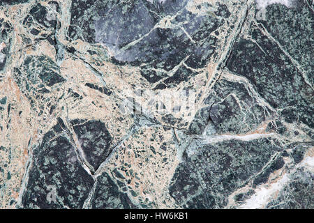 A background of old weathered black marble. Stock Photo