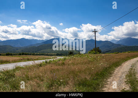 Walking tour through the romanian countryside, mountains, villages, waters. Holidays in carpathian nature. Stock Photo