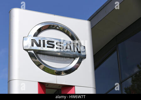 Nissan dealership sign in front of the showroom Stock Photo