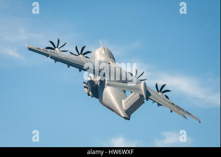 Farnborough, UK - July 18, 2014: Closeup of an Airbus A400M military transporter aircraft in a steep climb after take-off from Farnborough, Hampshire, Stock Photo