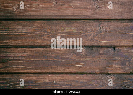 Retro background from wooden boards painted in dark brown color Stock Photo