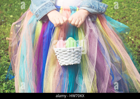 Easter eggs - little girl holding basket with easter eggs Stock Photo