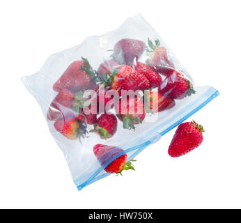 Strawberry in clear plastic bag isolated on white background . Stock Photo