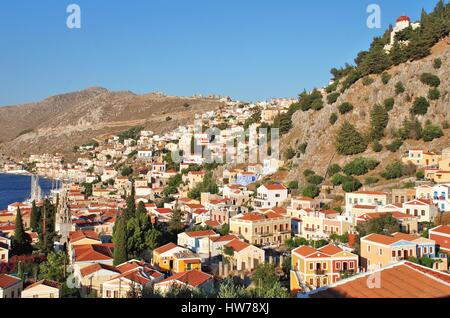 Looking down onto the neo classical buildings of Yialos on the Greek island of Symi. Stock Photo