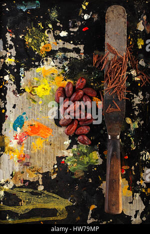 shredded chocolate and cocoa beans  on vintage painted background Stock Photo