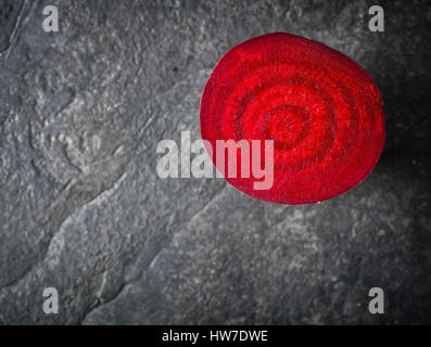 Beets cut on a black stone background. Lots of space for text. Stock Photo
