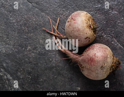 Beets on a black stone background. Lots of space for text. Stock Photo