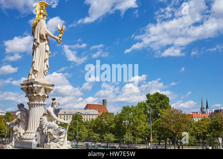 Vienna, Austria - August 14, 2016: Side view of the Pallas Athena sculpture in front of the main entrance to the Austrian Parliament Building. Stock Photo