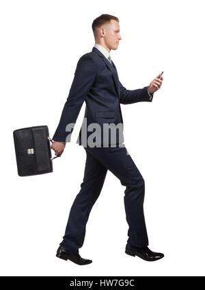 Running businessman with his briefcase and mobile phone on white Stock Photo