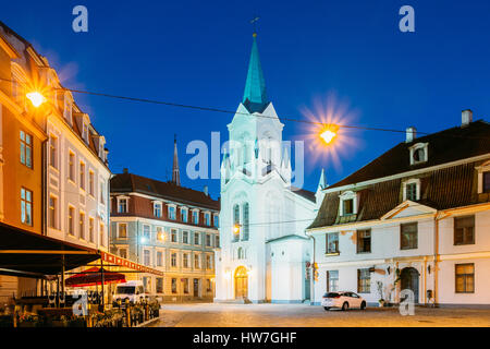Riga, Latvia - July 1, 2016: Virgin Of Anguish Or Our Lady Of Sorrows Church, Ancient Catholic Church On Pils Street In Evening Illumination In Summer Stock Photo