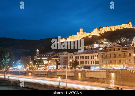 Tbilisi, Georgia - October 21, 2016: Narikala Ancient Fortress In Evening Night Illumination Under Blue Sky. Stock Photo