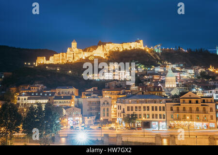 Tbilisi, Georgia - October 21, 2016: Narikala Ancient Fortress In Evening Night Illumination Under Blue Sky. Stock Photo