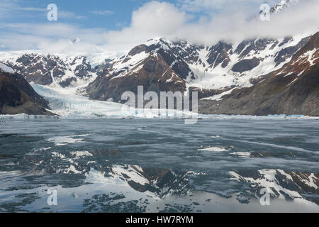 Pedersen Glacier Upper Pedersen Lagoon frozen in spring in Kenai Fjords National Park, Alaska. Stock Photo