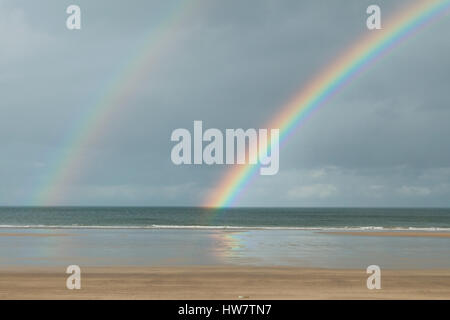 Double rainbow at Benone Beach in Northern Ireland. Stock Photo