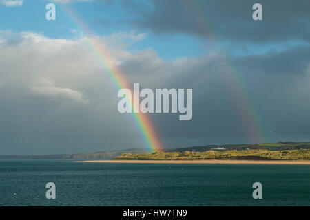 Double rainbow over the sand dunes in Portrush, Northern Ireland. Stock Photo