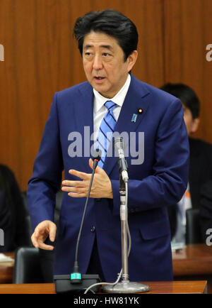 Tokyo, Japan. 17th Mar, 2017. Japanese Prime Minister Shinzo Abe answers a question by an opposition lawmaker at the Lower House's foreign affairs committee session at the National Diet in Tokyo on Friday, March 17, 2017. Abe is now center in a land deal scandal of a Osaka elementary school as he donated to the school operator Yasunori Kagoike, news reported. Credit: Yoshio Tsunoda/AFLO/Alamy Live News