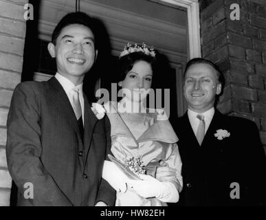 Dec. 12, 1960 - Yehudi Menuhin's Daughter Weds Chinese Pianist- The wedding took place this morning at Hampstead Register Office of twenty year old Zamira Menuhin daughter of world famous violinist Yehudi Menuhin to twenty six year old Mr. Fou Ts'ong who fled from Communist China two years ago to the West - to gain fame as a pianist. Keystone Photo Shows:- Yehudi Menuhin with the bride and bridegroom after the wedding this morning. JSS/KEYSTONE EM/725124 (Credit Image: © Keystone Press Agency/Keystone USA via ZUMAPRESS.com) Stock Photo