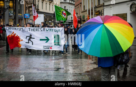 Baden-Baden, Germany. 18th Mar, 2017. Demonstrators walk through the inner city of Baden-Baden, Germany, 18 March 2017. The city is hosting the meeting of the G20 finance ministers. Photo: Christoph Schmidt/dpa/Alamy Live News Stock Photo