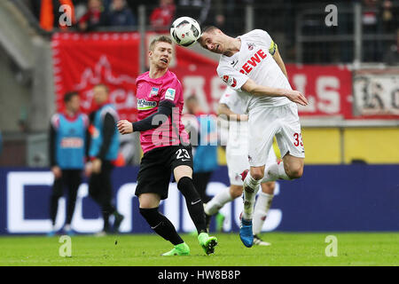 Cologne, Germany. 18th Mar, 2017. Matthias Lehmann (R) of 1. FC Koeln vies with Mitchell Weiser of Hertha BSC during the Bundesliga match at RheinEnergieStadion in Cologne, Germany, on March 18, 2017. 1. FC Koeln won the match 4-2. Credit: Ulrich Hufnagel/Xinhua/Alamy Live News Stock Photo