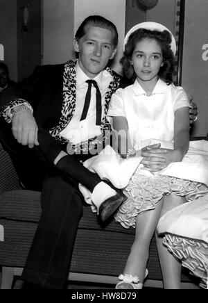 Mar. 26, 1958 - Home Office To Investigate Marriage of Jerry Lee Lewis; The Home Office is tomorrow to investigate the marriage middle of the 22 year old American Rock n Roll singer, Jerry Lee Lewis, who is over here on tour - and his 15 year old wife, Myra. Lewis and Myra are staying in London. During the week-end it was discovered that their marriage last December was fix became final. Myra's father Mr. J.W. Brown, his wife, Lois and his son, are staying at the same hotel in London. Home Office Officials will look into the marriage when Lewi's landing papers are forwarded from Immigration Of Stock Photo